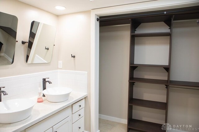 316 Honey Jane Dr, Beavercreek, OH 45434 - bathroom with double vanity and decorative backsplash