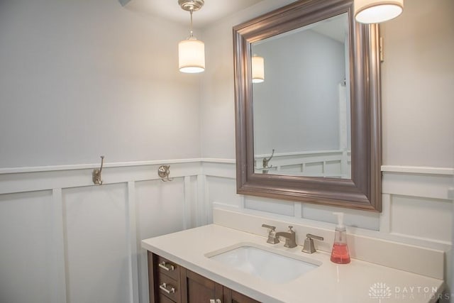 316 Honey Jane Dr, Beavercreek, OH 45434 - bathroom featuring a decorative wall, vanity, and wainscoting