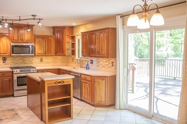 316 Honey Jane Dr, Beavercreek, OH 45434 - kitchen featuring appliances with stainless steel finishes, open shelves, a sink, and light countertops