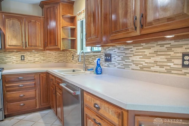 316 Honey Jane Dr, Beavercreek, OH 45434 - kitchen with dishwasher, a sink, brown cabinets, and backsplash