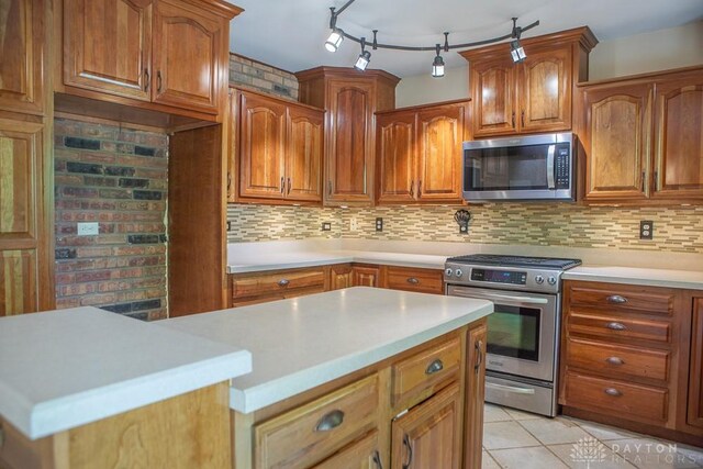 316 Honey Jane Dr, Beavercreek, OH 45434 - kitchen featuring stainless steel appliances, light countertops, and brown cabinets