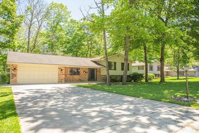 316 Honey Jane Dr, Beavercreek, OH 45434 - split level home featuring brick siding, a garage, driveway, and a front yard