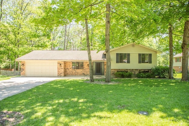 316 Honey Jane Dr, Beavercreek, OH 45434 - tri-level home featuring driveway, a garage, a front yard, and brick siding