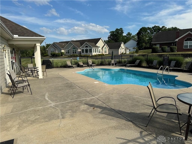 5023 Crescent Ridge Dr, Clayton, OH 45315 - community pool featuring a patio area and a residential view