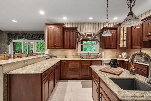 7607 Stone Ridge Dr, Springboro, OH 45066 - kitchen featuring a sink, recessed lighting, decorative backsplash, and pendant lighting