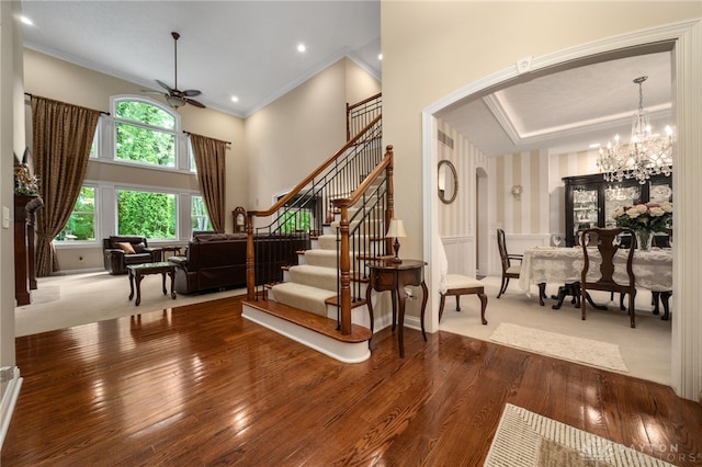 7607 Stone Ridge Dr, Springboro, OH 45066 - entrance foyer with arched walkways, a ceiling fan, wood-type flooring, stairs, and ornamental molding