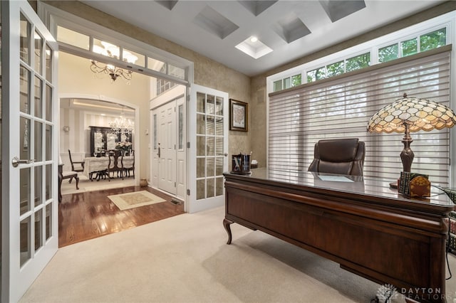 7607 Stone Ridge Dr, Springboro, OH 45066 - office with a chandelier, french doors, coffered ceiling, carpet floors, and arched walkways
