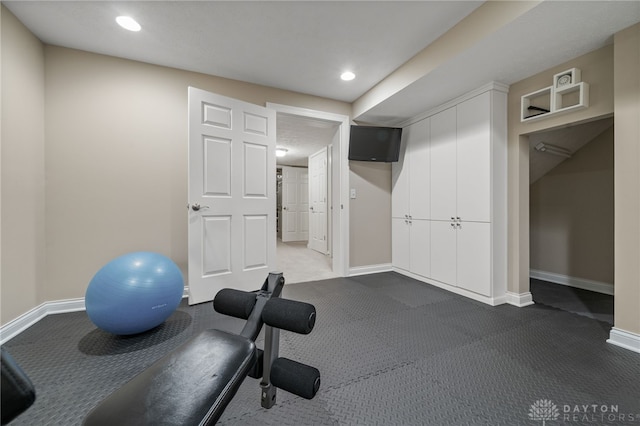 7607 Stone Ridge Dr, Springboro, OH 45066 - exercise room featuring baseboards, recessed lighting, and dark carpet