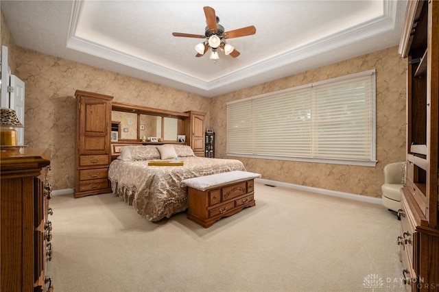 7607 Stone Ridge Dr, Springboro, OH 45066 - bedroom with light carpet, a tray ceiling, baseboards, crown molding, and ceiling fan