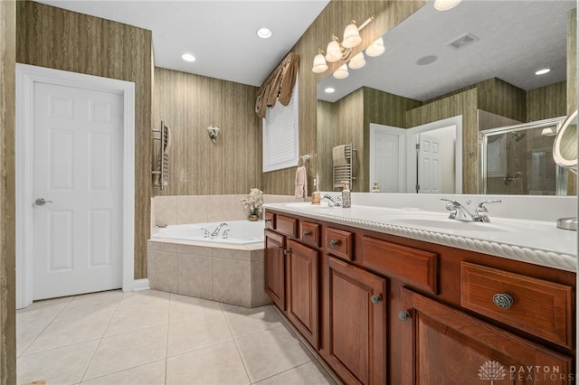 7607 Stone Ridge Dr, Springboro, OH 45066 - full bath featuring tile patterned flooring, a bath, a shower stall, double vanity, and a towel warming rack