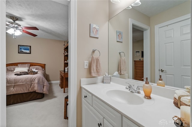 7607 Stone Ridge Dr, Springboro, OH 45066 - bathroom with a textured ceiling, vanity, a ceiling fan, and connected bathroom