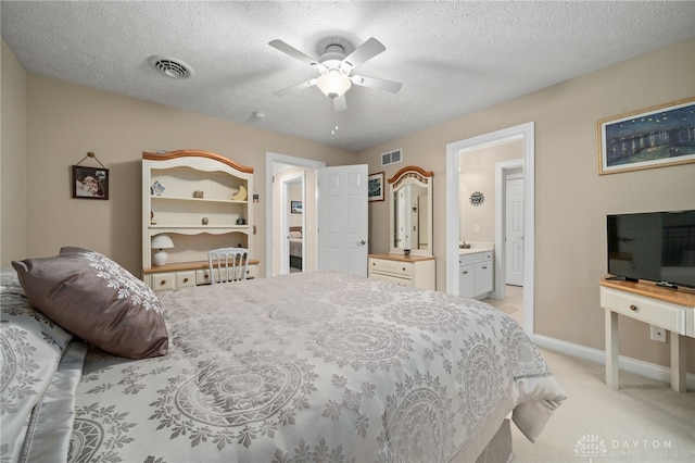 7607 Stone Ridge Dr, Springboro, OH 45066 - bedroom with ensuite bath, light colored carpet, baseboards, ceiling fan, and a textured ceiling