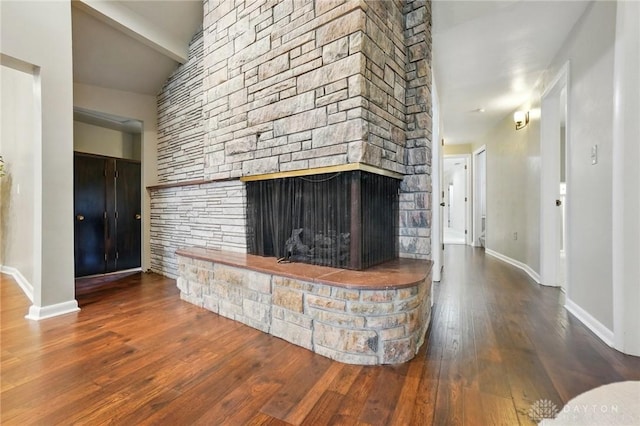 450 Ridgewood Ave, Oakwood, OH 45409 - living room with a stone fireplace, hardwood / wood-style floors, and baseboards