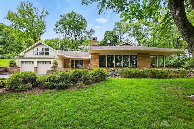 450 Ridgewood Ave, Oakwood, OH 45409 - view of front facade featuring a chimney, a front lawn, and stone siding