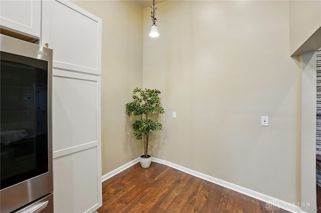 450 Ridgewood Ave, Oakwood, OH 45409 - corridor featuring baseboards and dark wood finished floors
