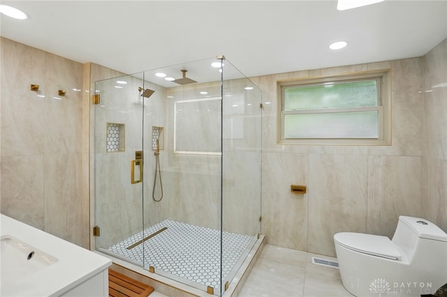 450 Ridgewood Ave, Oakwood, OH 45409 - full bathroom with a stall shower, toilet, vanity, and tile patterned floors