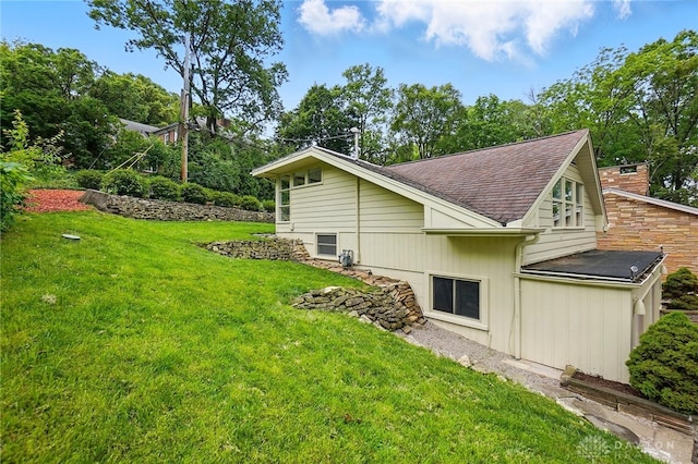 450 Ridgewood Ave, Oakwood, OH 45409 - view of home's exterior with a lawn, a shingled roof, and a chimney