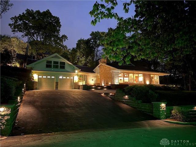 450 Ridgewood Ave, Oakwood, OH 45409 - view of front of home featuring concrete driveway and a chimney