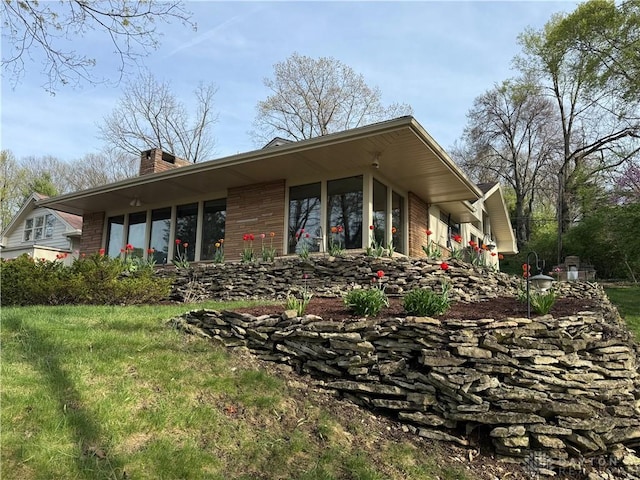 450 Ridgewood Ave, Oakwood, OH 45409 - back of house featuring brick siding and a chimney
