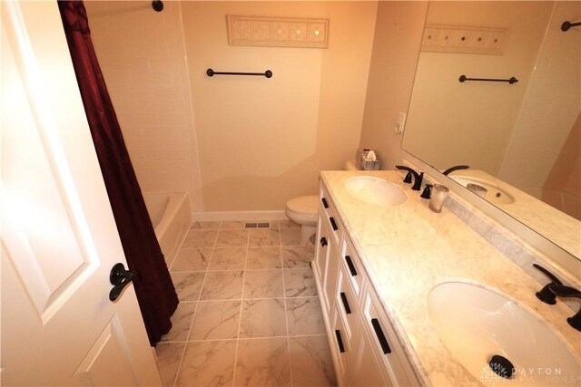 9543 Hacker Farm Ln, Centerville, OH 45458 - bathroom featuring double vanity, baseboards, toilet, and shower / tub combo