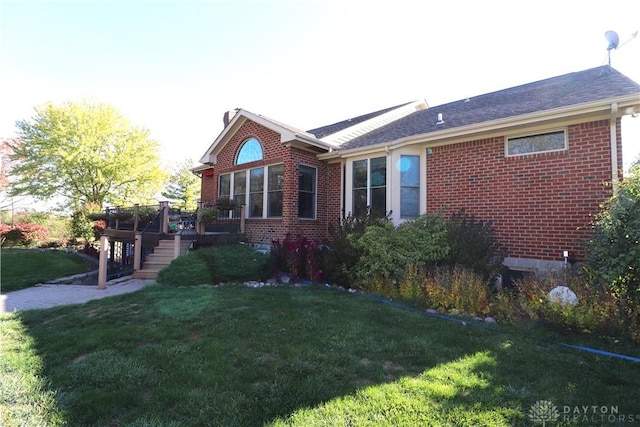 9543 Hacker Farm Ln, Centerville, OH 45458 - view of property exterior featuring a wooden deck, a yard, brick siding, and stairway