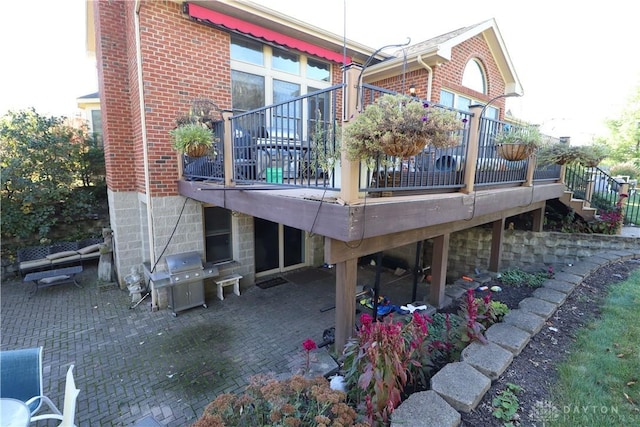 9543 Hacker Farm Ln, Centerville, OH 45458 - back of house featuring a patio, stairway, brick siding, and a wooden deck