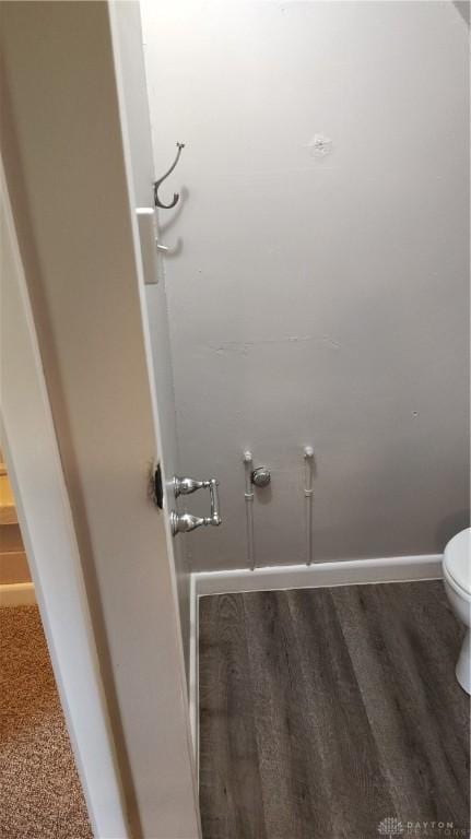 413 W Lake Ave, New Carlisle, OH 45344 - detailed view of toilet and baseboards