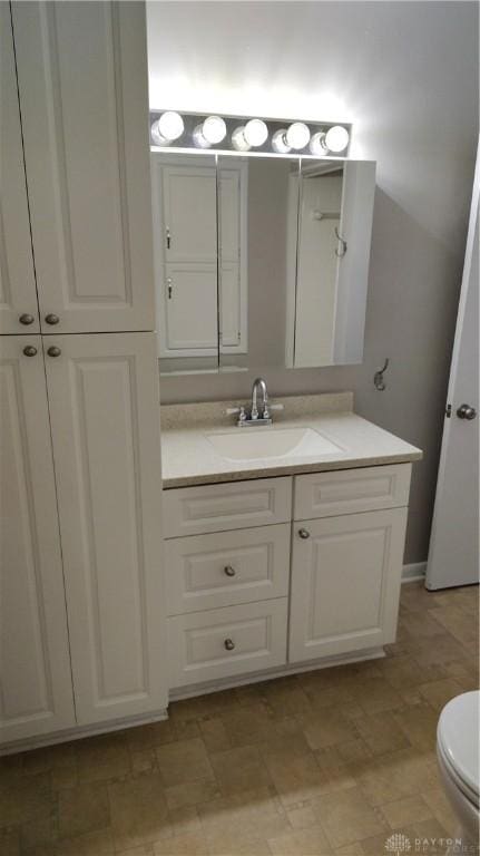 413 W Lake Ave, New Carlisle, OH 45344 - bathroom with vanity and toilet