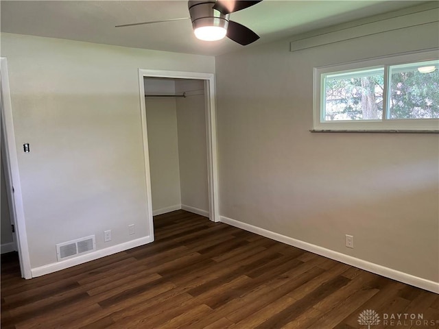 8700 Adams Rd, Dayton, OH 45424 - unfurnished bedroom featuring baseboards, dark wood-style flooring, a closet, and ceiling fan