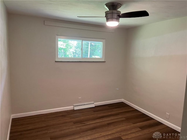 8700 Adams Rd, Dayton, OH 45424 - empty room with a baseboard heating unit, dark wood finished floors, baseboards, and a ceiling fan