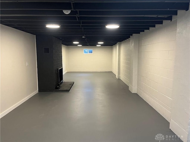 8700 Adams Rd, Dayton, OH 45424 - finished basement featuring a fireplace and concrete block wall