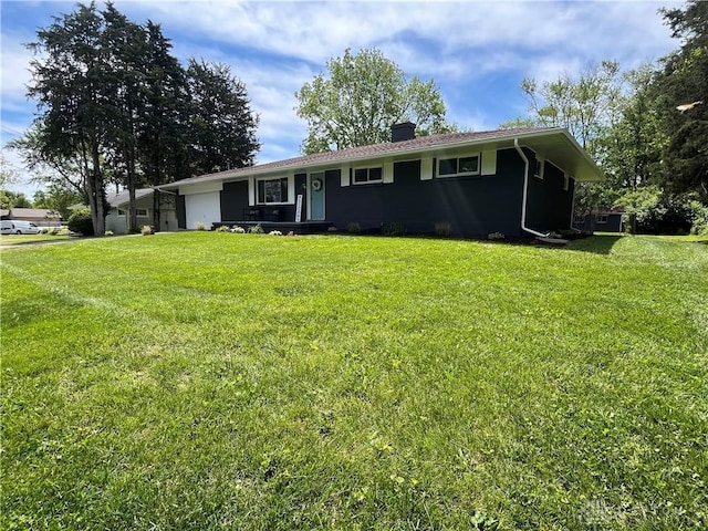 8700 Adams Rd, Dayton, OH 45424 - ranch-style house featuring a garage, a chimney, and a front yard