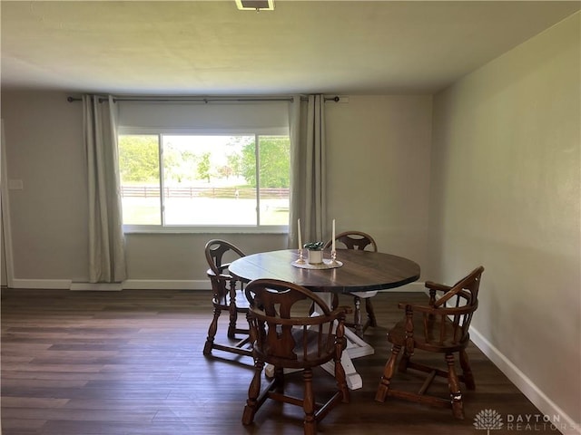 8700 Adams Rd, Dayton, OH 45424 - dining area with baseboards and dark wood finished floors