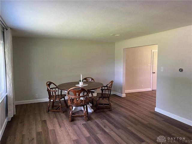 8700 Adams Rd, Dayton, OH 45424 - dining area featuring dark wood-type flooring and baseboards