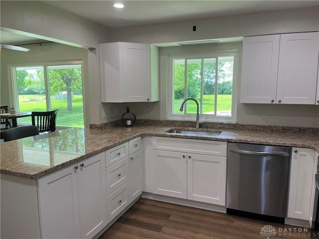 8700 Adams Rd, Dayton, OH 45424 - kitchen featuring stainless steel dishwasher, a sink, white cabinets, healthy amount of natural light, and recessed lighting