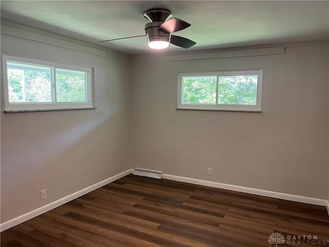 8700 Adams Rd, Dayton, OH 45424 - unfurnished room with baseboards, dark wood-type flooring, and ceiling fan