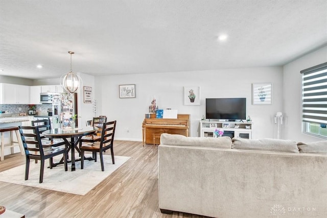 1852 Amelia Way, Dayton, OH 45439 - living area featuring light wood-style floors, recessed lighting, and baseboards