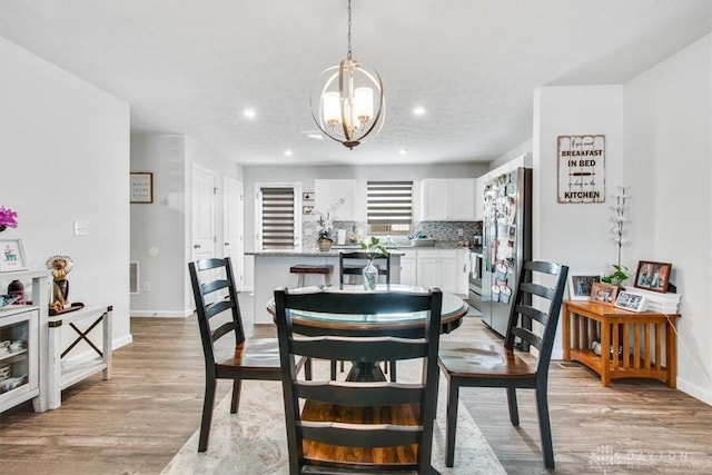1852 Amelia Way, Dayton, OH 45439 - dining space with light wood-type flooring, a chandelier, baseboards, and recessed lighting