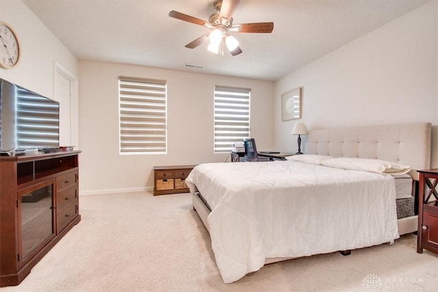 1852 Amelia Way, Dayton, OH 45439 - bedroom with light colored carpet, baseboards, and ceiling fan