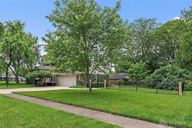 5135 Lamonte Dr, Fairfield, OH 45014 - view of front facade featuring driveway and a garage