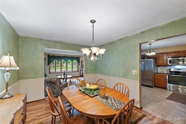 5135 Lamonte Dr, Fairfield, OH 45014 - dining room with a chandelier and light wood-type flooring