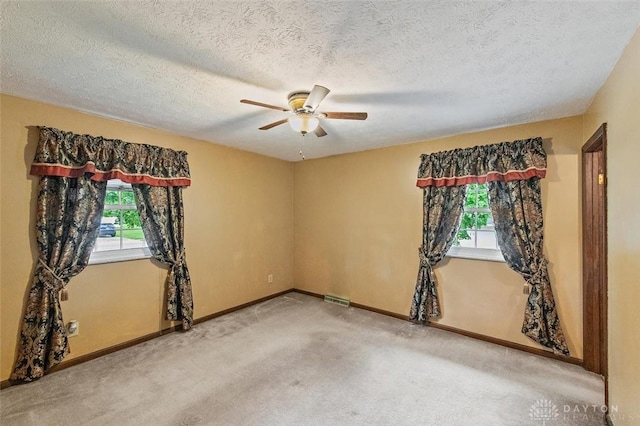 5135 Lamonte Dr, Fairfield, OH 45014 - spare room featuring ceiling fan, carpet floors, baseboards, and a textured ceiling