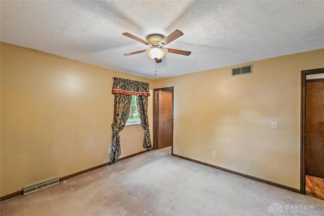 5135 Lamonte Dr, Fairfield, OH 45014 - spare room featuring ceiling fan, carpet flooring, baseboards, and a textured ceiling
