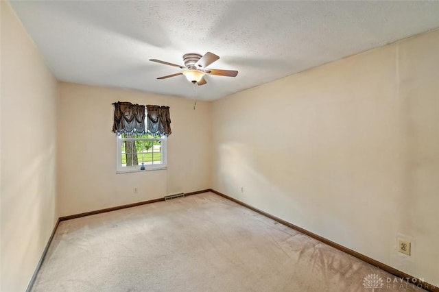 5135 Lamonte Dr, Fairfield, OH 45014 - spare room with light colored carpet, ceiling fan, and baseboards
