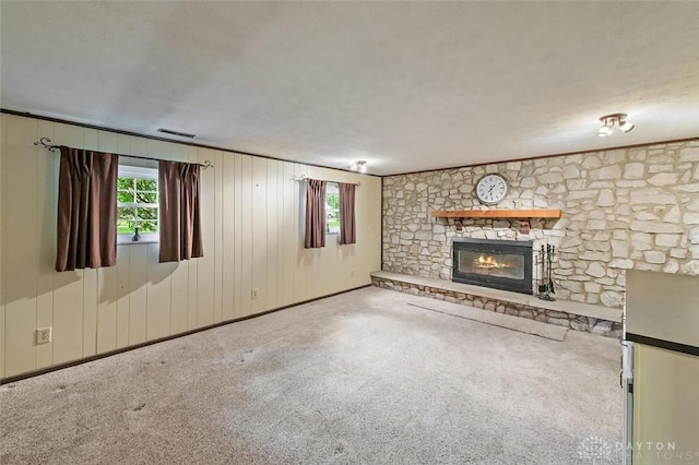 5135 Lamonte Dr, Fairfield, OH 45014 - unfurnished living room featuring a stone fireplace and carpet floors