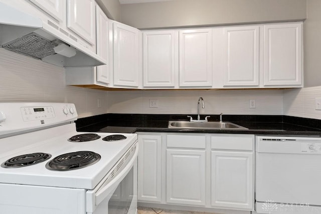 1050 Frederick Dr, Xenia, OH 45385 - kitchen featuring white appliances, under cabinet range hood, a sink, white cabinetry, and dark countertops