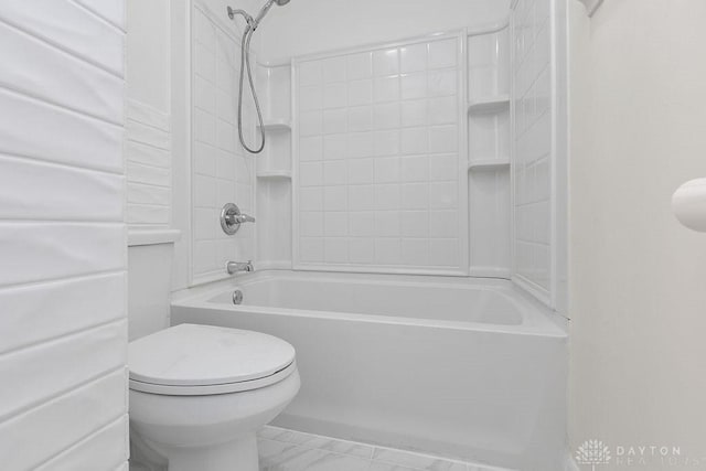 1050 Frederick Dr, Xenia, OH 45385 - full bathroom featuring toilet, bathtub / shower combination, and marble look tiles