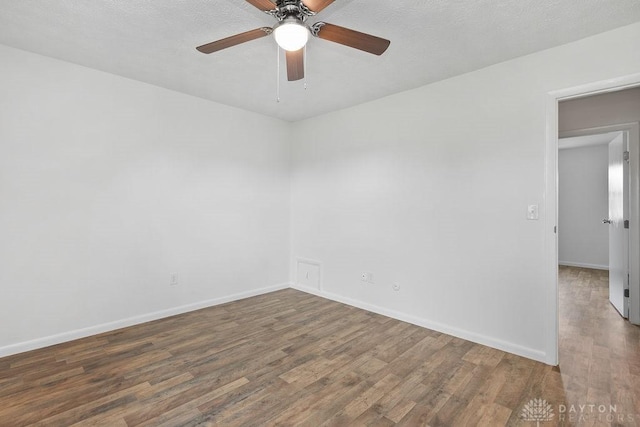 1050 Frederick Dr, Xenia, OH 45385 - unfurnished room featuring wood finished floors, a ceiling fan, and baseboards