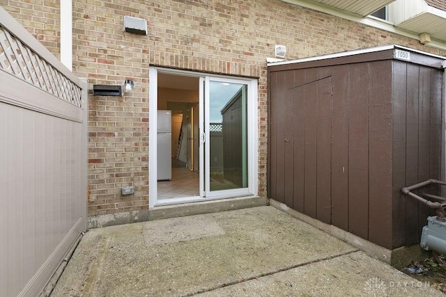 1050 Frederick Dr, Xenia, OH 45385 - property entrance featuring brick siding