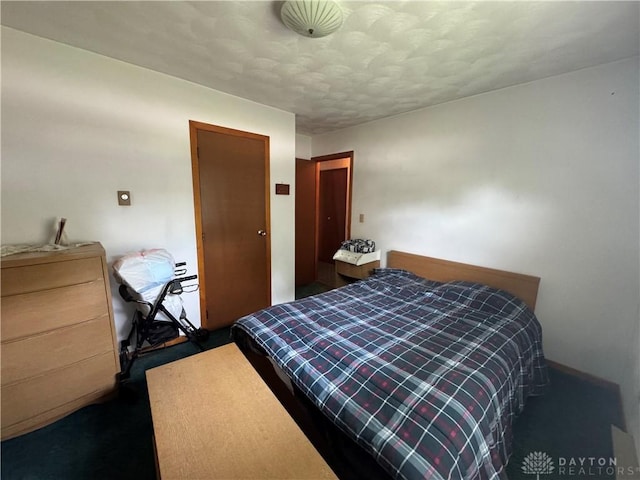 326 Little League Dr, Eaton, OH 45320 - bedroom featuring carpet and a textured ceiling
